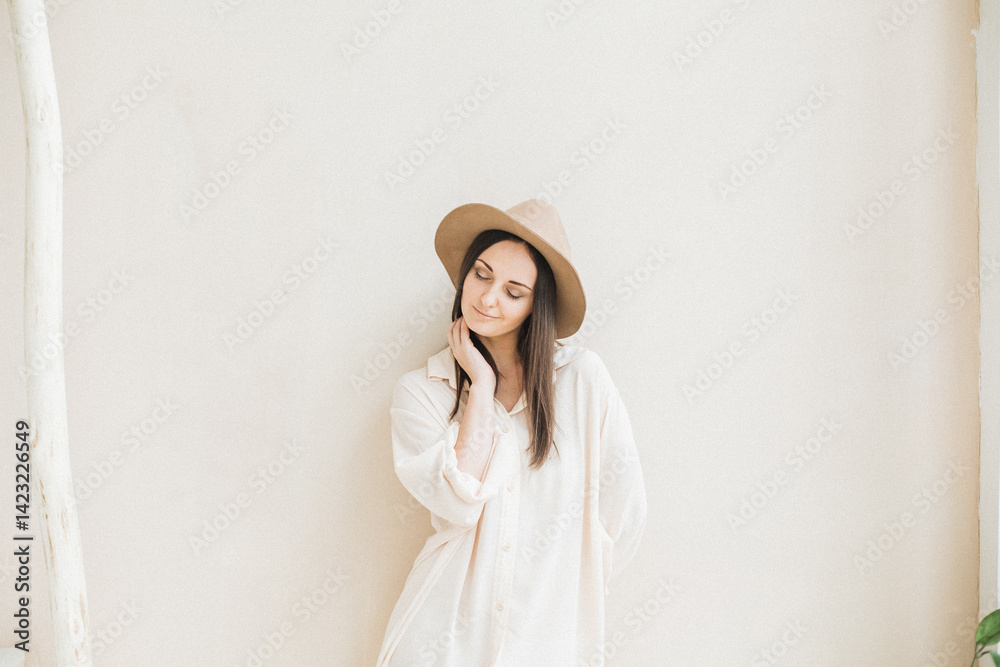 Portrait of Woman in Hat Against Neutral Background Portrait of Woman in Hat Against Neutral Background