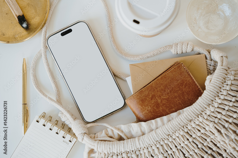 Minimalist Composition with Notebook, Cotton Bag, and Smartphone in Warm Light Minimalist Composition with Notebook, Cotton Bag, and Smartphone in Warm Light