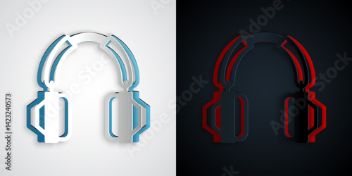 Paper cut Headphones icon isolated on grey and black background. Earphones. Concept for listening to music, service, communication and operator. Paper art style. Vector