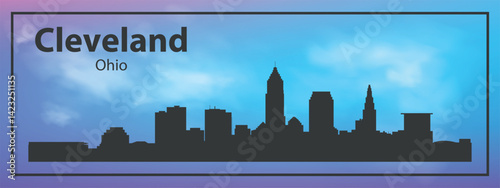 Silhouette of the Cleveland skyline, Ohio, USA. The view of the city skyline is set against a blue sky with a purple gradient, which creates an atmosphere of calm and evening comfort.