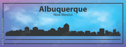 Silhouette of the Albuquerque skyline, New Mexico, USA. The view of the city skyline is set against a blue sky with a purple gradient, which creates an atmosphere of calm and evening comfort.