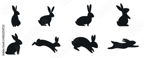 A set of Easter bunnies silhouette in different shapes and actions isolated on a white background.