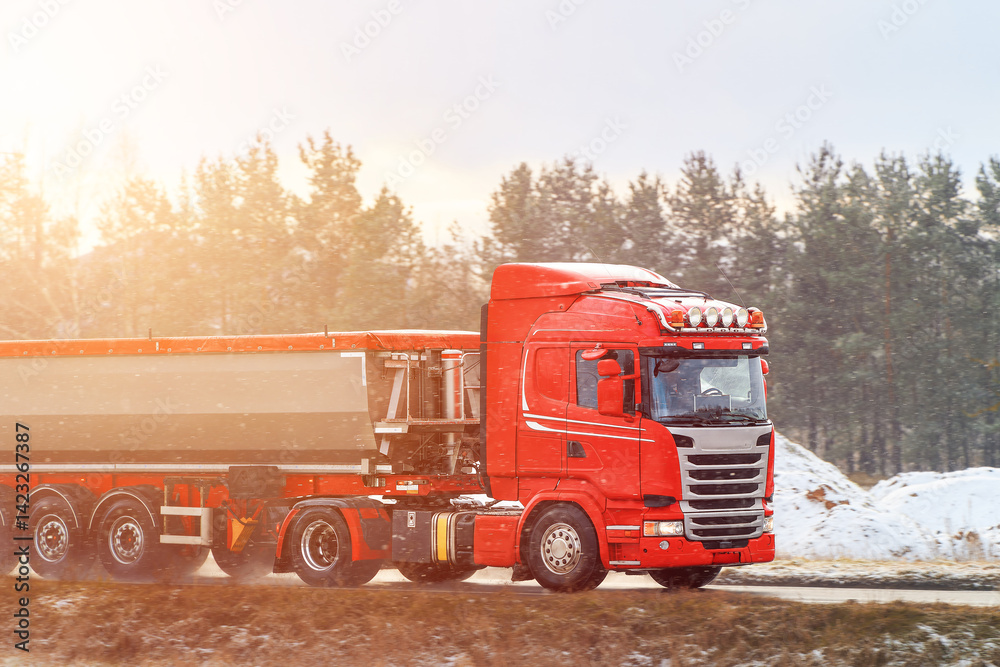Cargo truck moving near industrial area