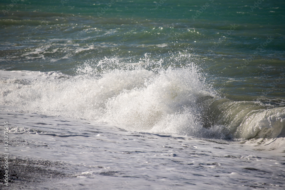 The ocean is rough and the waves are crashing against the shore The ocean is rough and the waves are crashing against the shore