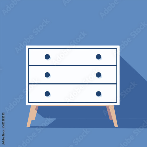 Modern white dresser against blue wall with shadow and wooden legs