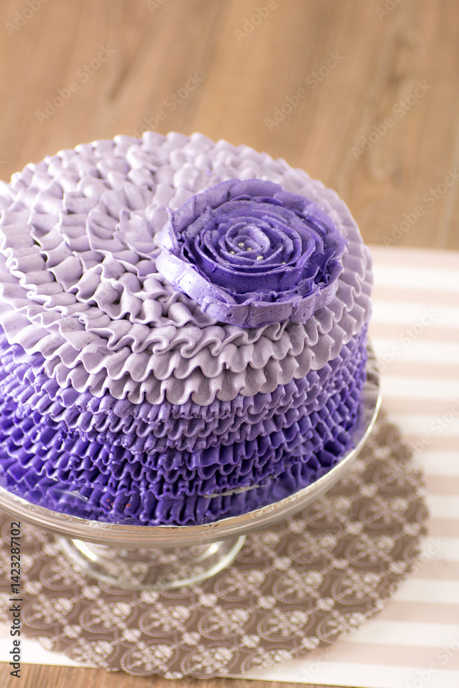 Obraz premium a beautiful whole cake decorated using buttercream in purple color