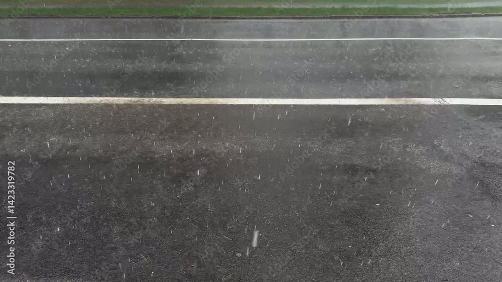 Heavy Rainfall on Pavement and Road, Wet Surface and Raindrops Splashing, Stormy Weather Scene Heavy Rainfall on Pavement and Road, Wet Surface and Raindrops Splashing, Stormy Weather Scene