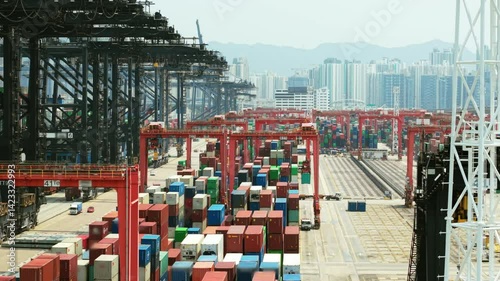 Modern container terminal managing logistics and freight transportation in hong kong, showcasing import and export operations within a dynamic global trade environment. Trade wars, tariffs photo