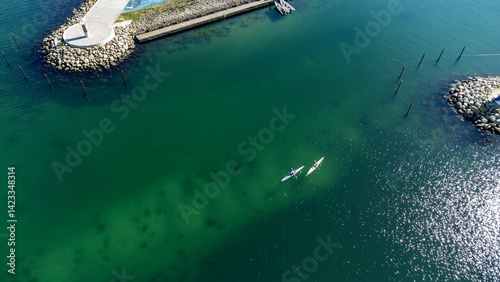 Kayaks in the turquoise water, just outside Aarhus marina and sailsport area