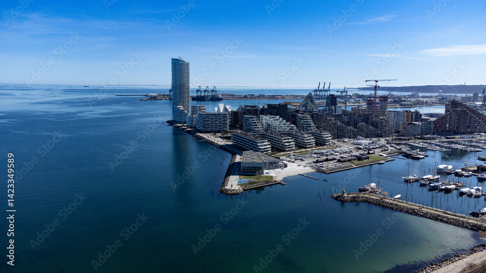 Aarhus oe with Lighthouse the marina and sailsport area. The comercial docks are in the background Aarhus oe with Lighthouse the marina and sailsport area. The comercial docks are in the background