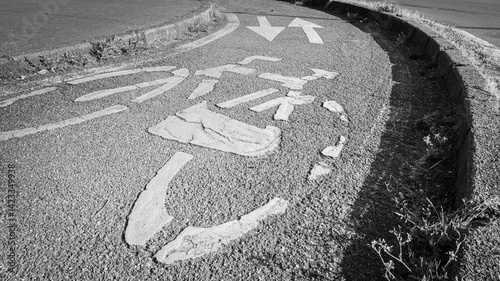 Fototapeta Naklejka Na Ścianę i Meble -  Simbol of a bicycle on the ground, in the cyclist lane, in Milan, Lombardy, Italy. Monochromatic.