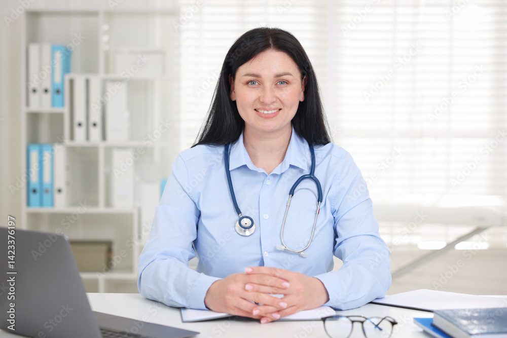 Professional doctor working at white desk in hospital Professional doctor working at white desk in hospital