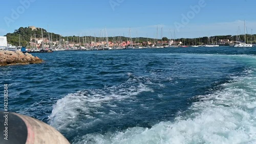 FRANCE, CASSIS - 09 JUIN 2024 : Wake of vessel. Wide wake trail from boat, Back view, High quality 4k footage