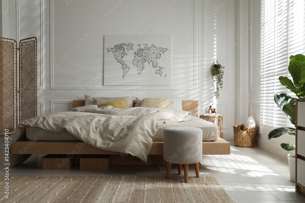Comfortable bed with soft linens in stylish room. Interior design