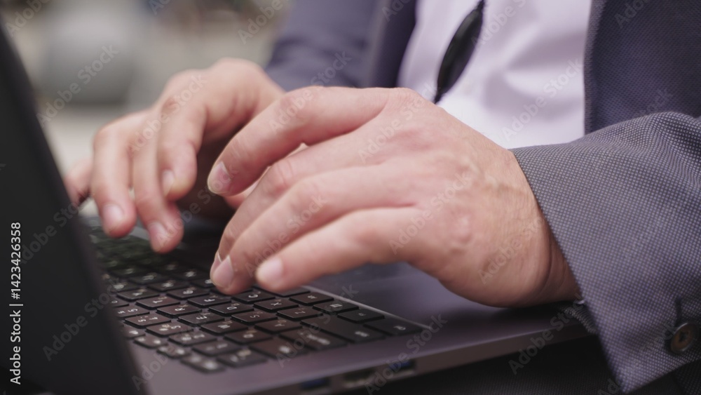 Man using laptop and headset while sitting in the city. Slow motion Man using laptop and headset while sitting in the city. Slow motion