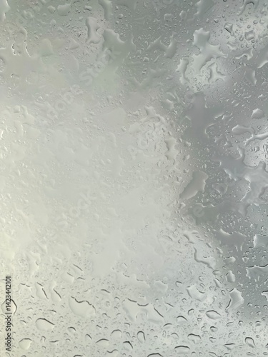 Rain falling through the glass, The sight of rain from the sky, Rain falling through clear glass.