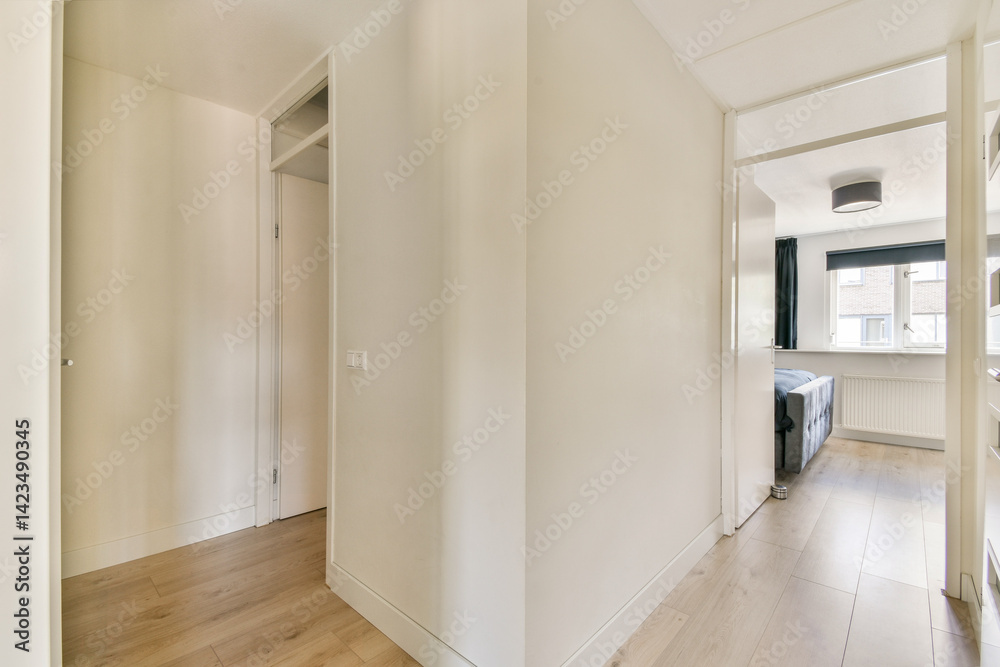 A clean and simple hallway featuring neutral colors and modern design elements. The space is well-lit and inviting, reflecting a minimalist aesthetic. A clean and simple hallway featuring neutral colors and modern design elements. The space is well-lit and inviting, reflecting a minimalist aesthetic.
