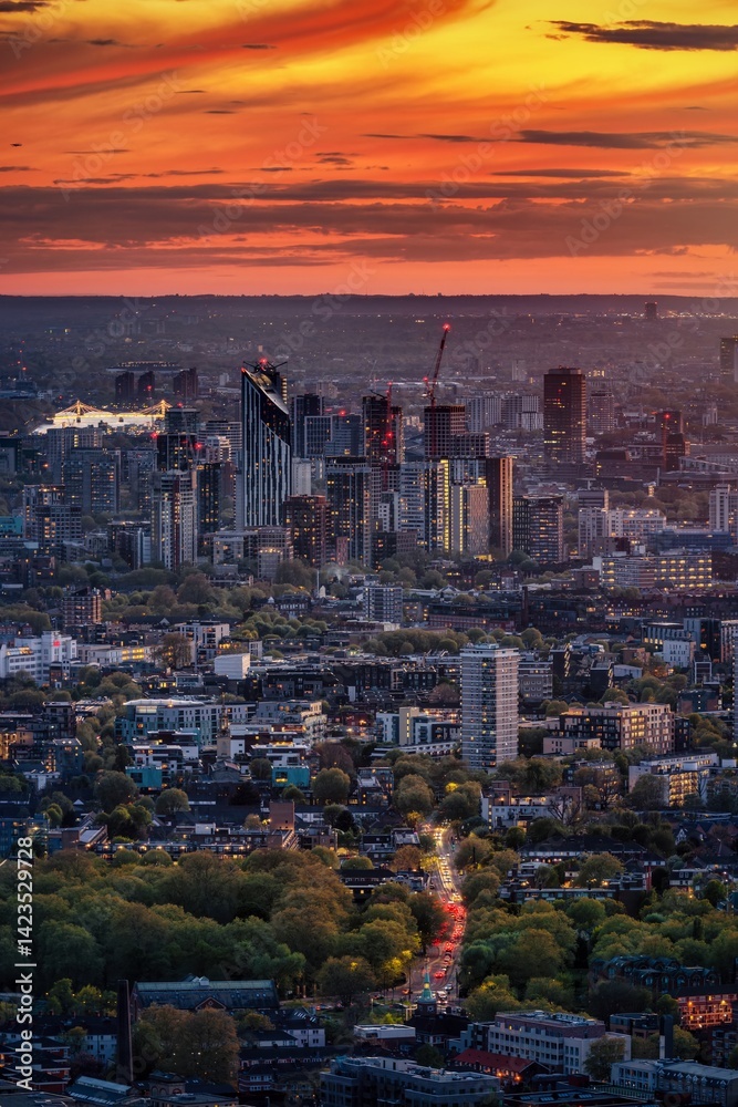 Elevated sunset view of the London skyline with Canada Water, Elephant and Castle and Chelsea district in the background