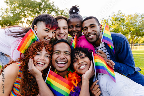 Canvastavla Happy multiethnic friends celebrating gay pride holding rainbow flags at park