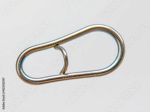 Obraz na płótnie A silver object with a hook on one end and a loop on the other. It is a keychain w salonie