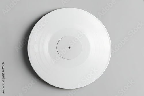 Minimalist mockup of a vinyl record with a blank white cover on a gray background