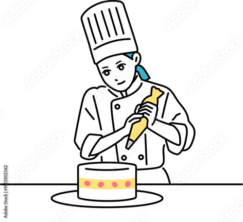 ケーキにクリームを絞る女性の料理人