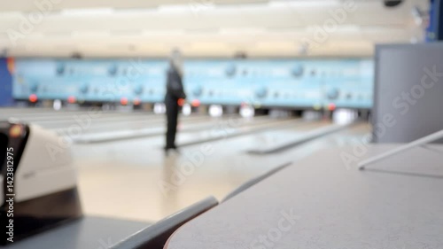 Wallpaper Mural A refreshing glass of beer sits invitingly in a lively bowling alley, perfectly capturing leisure and fun moments Torontodigital.ca