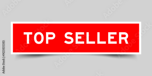 Red color square shape sticker label with word top seller on gray background