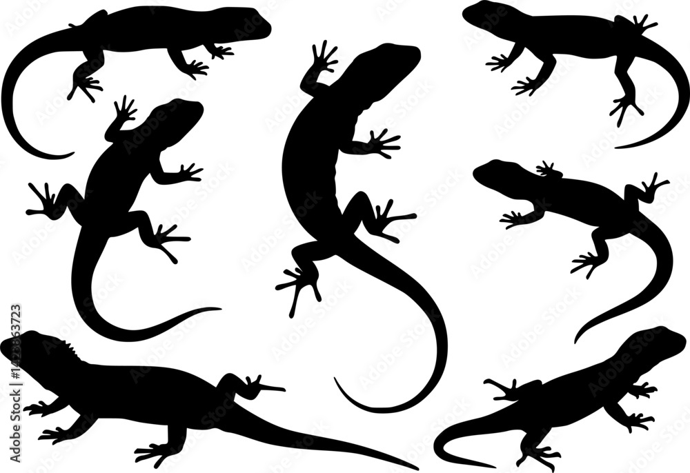 Naklejka premium Black silhouettes of lizards on a white background