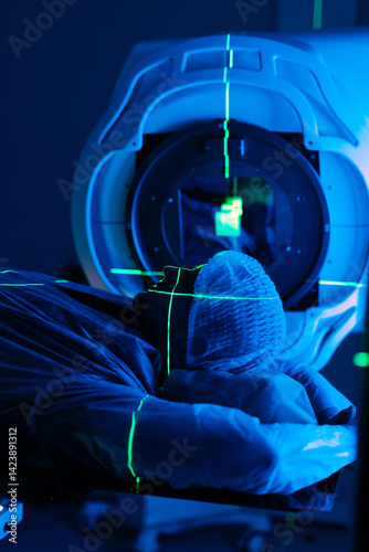 A man undergoing radiation therapy for cancer. Cancer treatment in a modern medical private clinic or hospital.  The concept of modern medical technology.