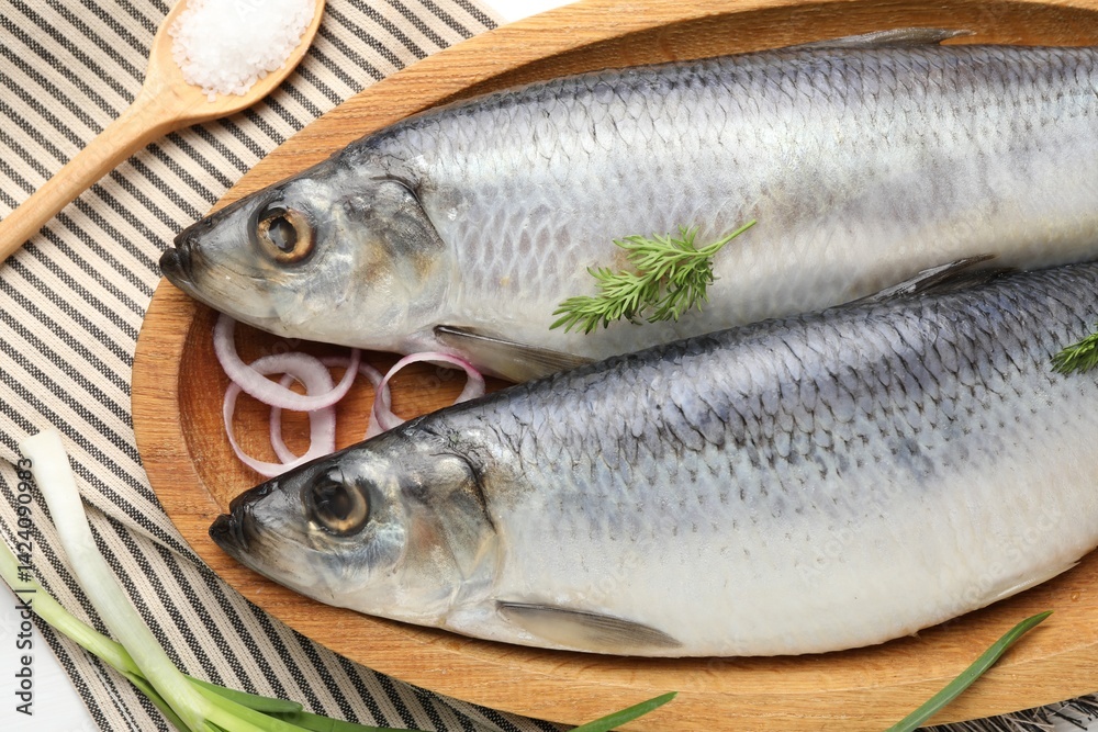 Salted herrings and spices on table, flat lay Salted herrings and spices on table, flat lay