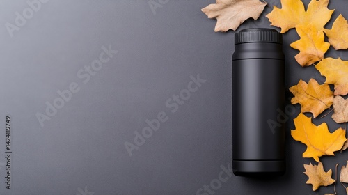 Black Vacuum Bottle Autumn Leaves Minimalist Style High-Resolution Studio Lighting Top-down Product Shot Matte Finish Stay Hydrated Fall Season Dark Grey Background Perfect for Branding Campaigns