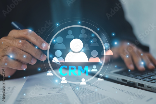 CRM management, the businessman personalizes customer experiences and optimizes sales processes to enhance customer satisfaction.