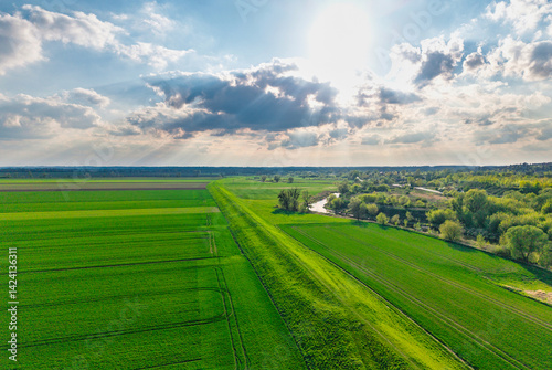 Obraz na płótnie Aerial landscape of the green fields in northern Poland at spring time w salonie