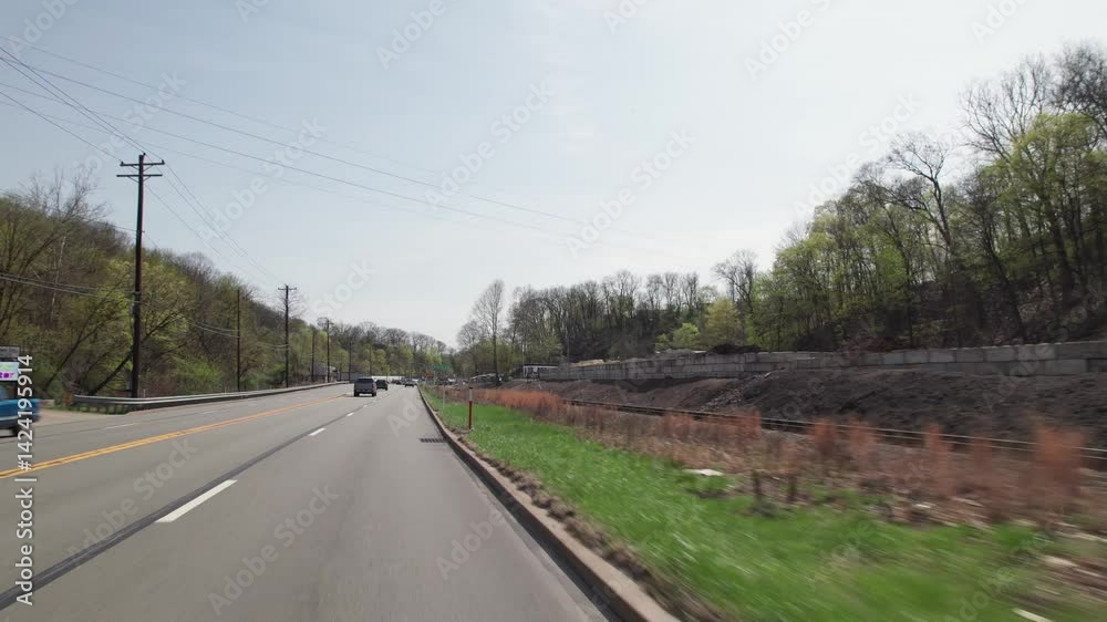Car driving on road point-of-view POV in greater Pittsburgh, PA area in north hills of roads, infrastructure, hills, lanes, buildings, homes, and businesses close to West Virginia landscape scenary Car driving on road point-of-view POV in greater Pittsburgh, PA area in north hills of roads, infrastructure, hills, lanes, buildings, homes, and businesses close to West Virginia landscape scenary