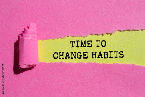Time to change habits message written on ripped torn pink paper on yellow background. Conceptual time to change habits symbol. Copy space.