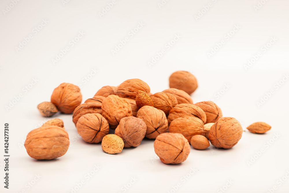 Assorted Nuts on White Background – Healthy Mix of Walnuts, Almonds, and Pecans (Isolated Top View).
Assorted Nuts on White Background – Healthy Mix of Walnuts, Almonds, and Pecans (Isolated Top View).