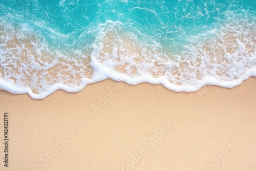 Fototapeta Naklejka Na Ścianę i Meble -  Ocean wave washing over sandy beach, turquoise water and foam meets tancolored sand
