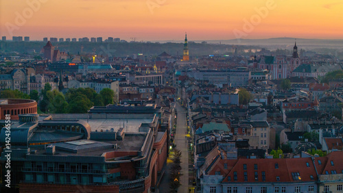 Cityscape of Poznań, Greater Poland, Poland — aerial top view of Polwiejska Street with the city hall visible in the distance at dusk.