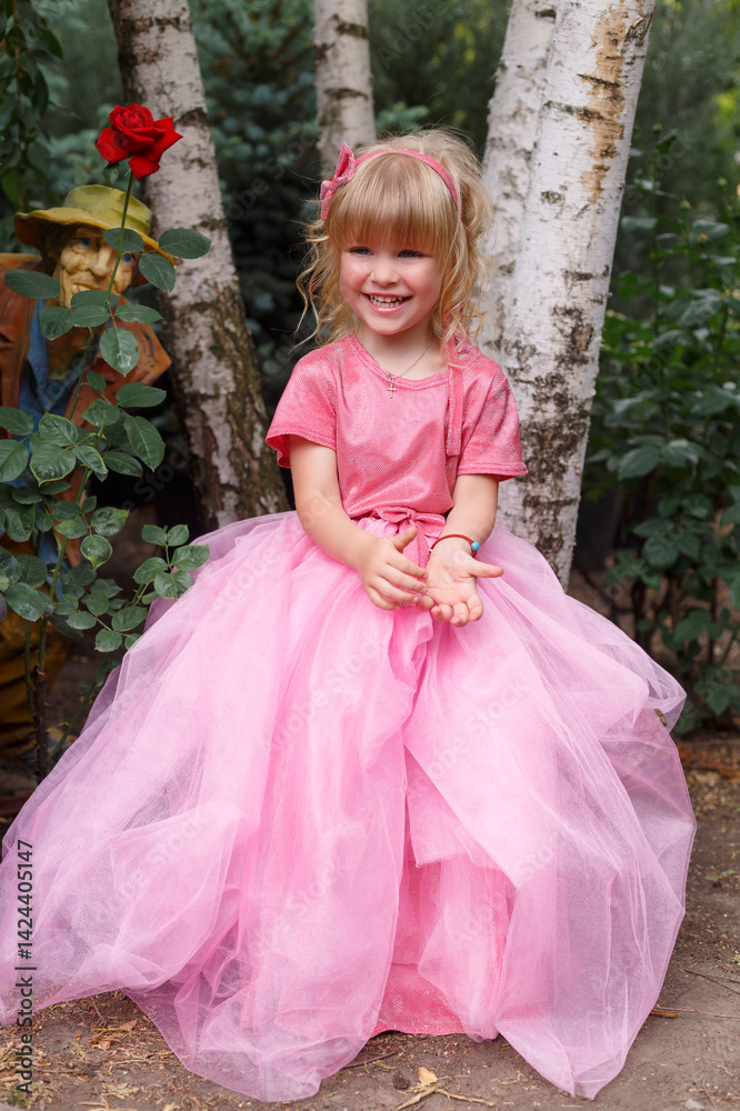 Fototapeta premium little girl in a pink dress