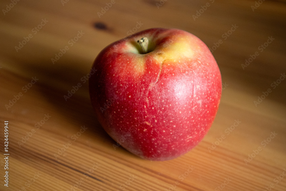 Healthy Red Apple on Rustic Wooden Table – Natural Light Nutrition Concept
Healthy Red Apple on Rustic Wooden Table – Natural Light Nutrition Concept
