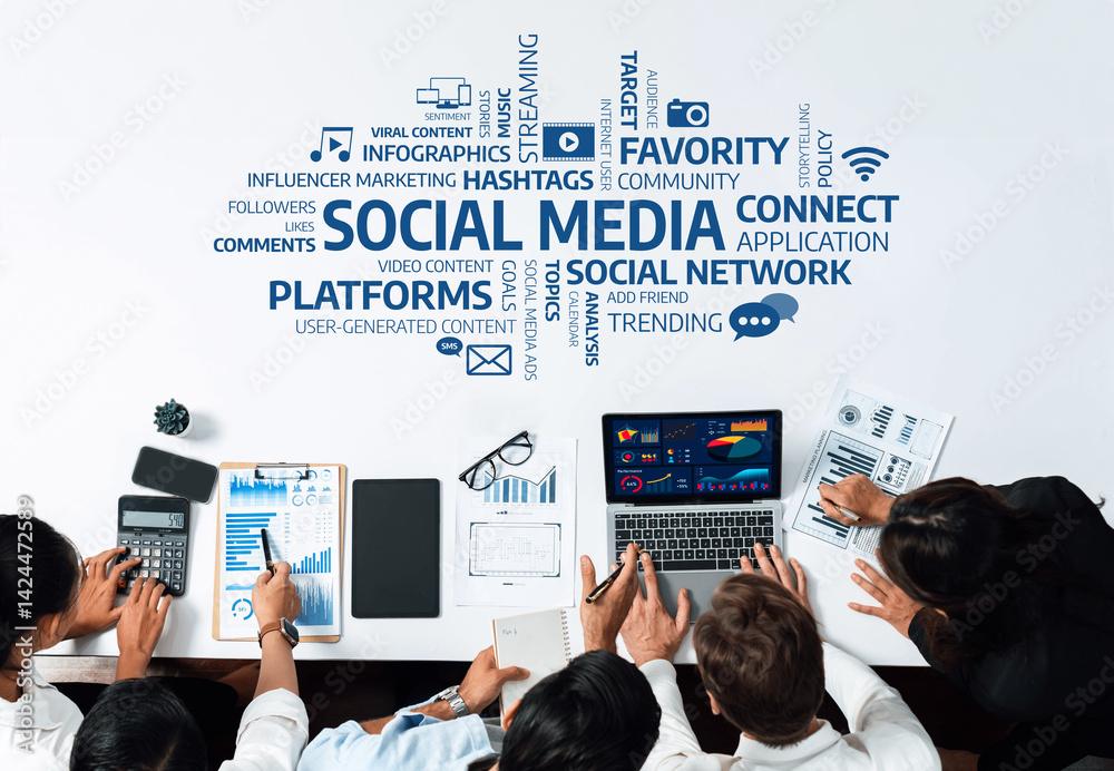 A team collaborates in a dynamic workspace focusing on social media strategy. They analyze data, discuss trends, and share creative ideas, enhancing digital marketing efforts. Amity