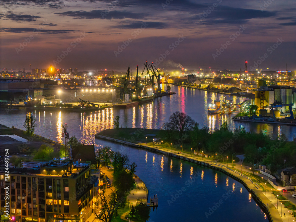The shipyard landscape of Gdansk by the Motlawa river at dusk. Poland