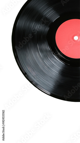 A black vinyl record with a red label spins on a turntable