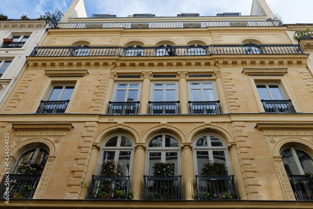 Obraz premium The typical facade of Parisian building, France.