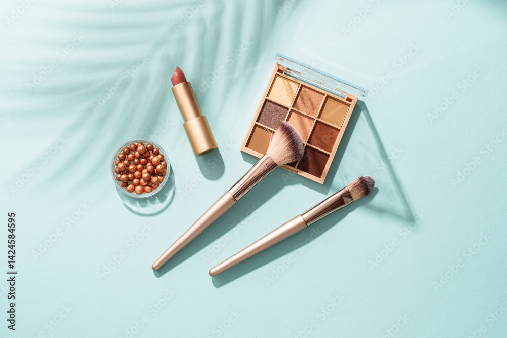 Make up products on blue background.