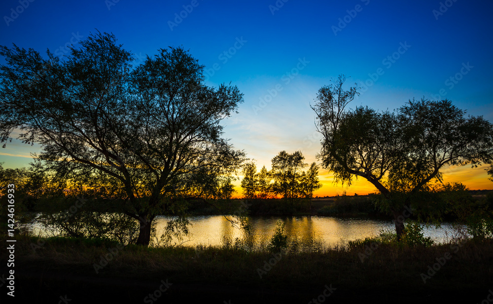 landscape of sunset with cloudy orange sky