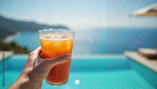 Obraz na płótnie Refreshing drink held by person overlooking ocean view, summer escape w salonie