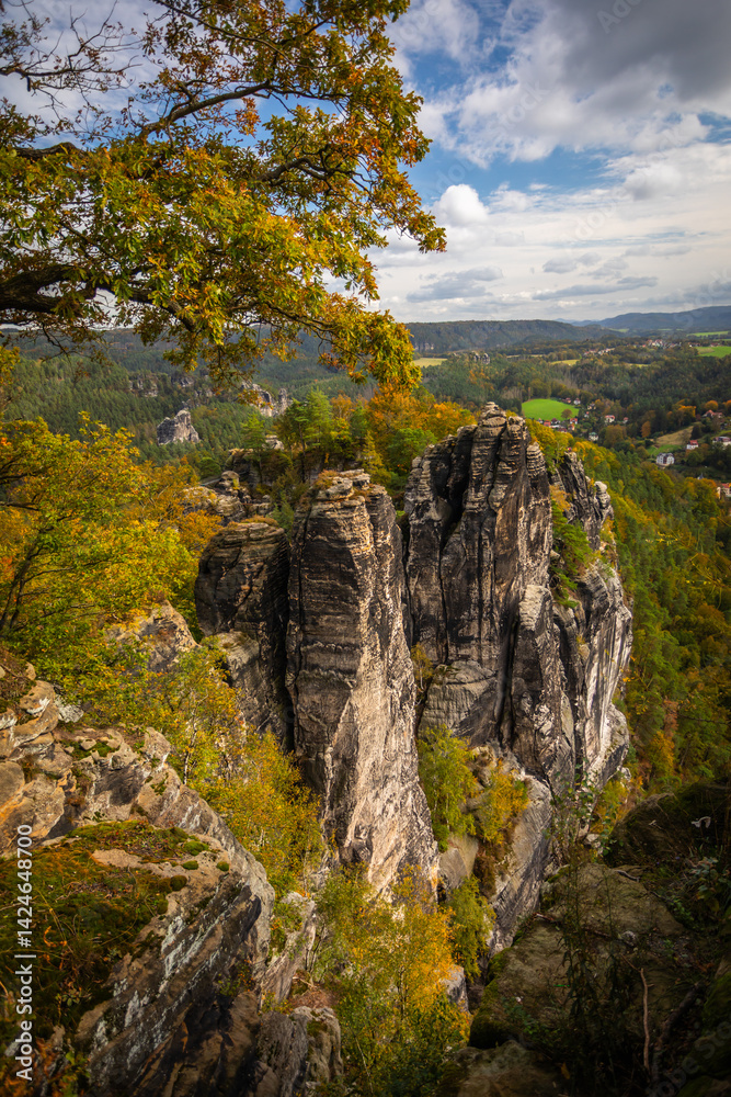 Beautiful Rock Formations of the Elbsandsteingebirge (Elbe Sandstone Mountains), a famous Tourist Attraction in Saxony, Germany, on a sunny Fall Day; Copy Space Beautiful Rock Formations of the Elbsandsteingebirge (Elbe Sandstone Mountains), a famous Tourist Attraction in Saxony, Germany, on a sunny Fall Day; Copy Space