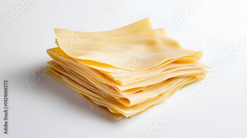 A minimalist view of lasagna sheets placed on a white background, with slight overlaps, showcasing their smooth and soft texture.